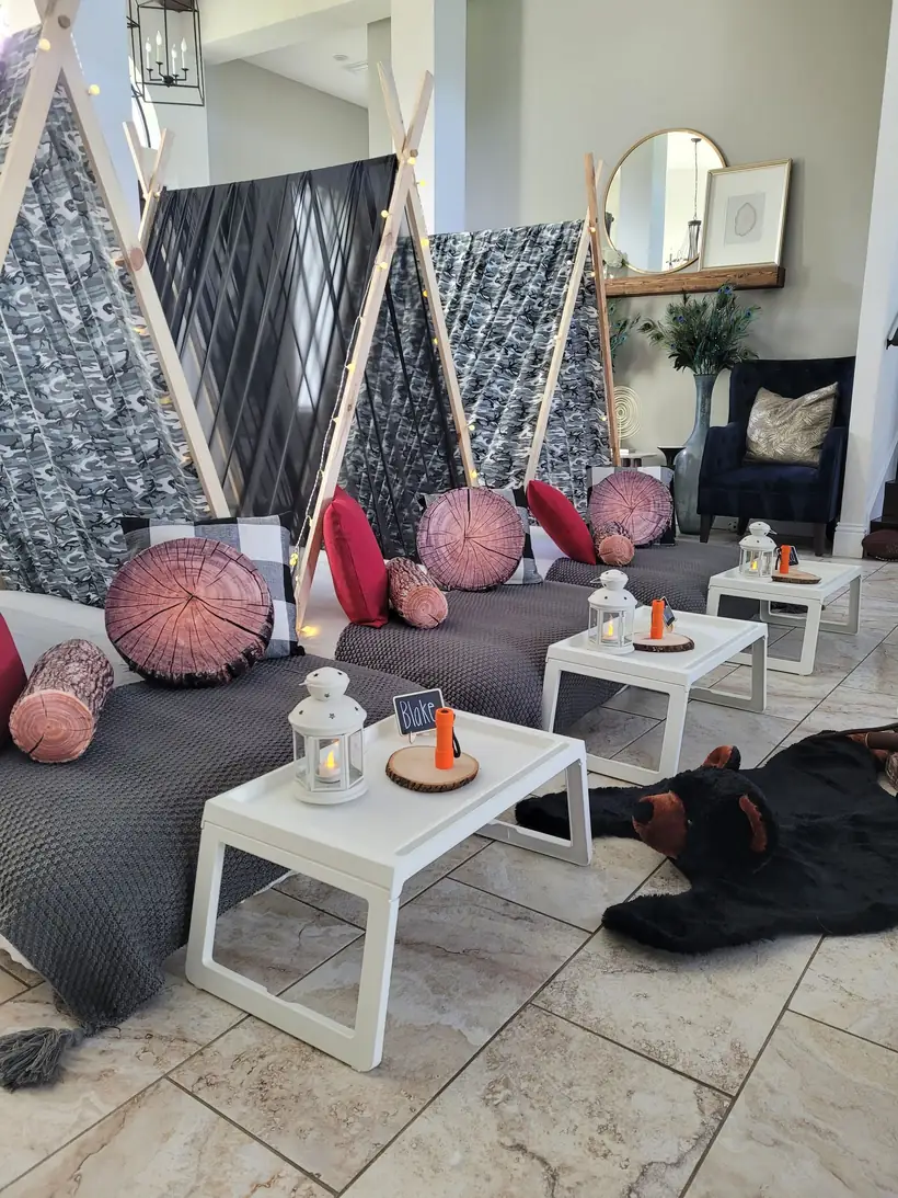 Themed teepee sleepover party setup with plaid bedding and lanterns in Tampa Bay
